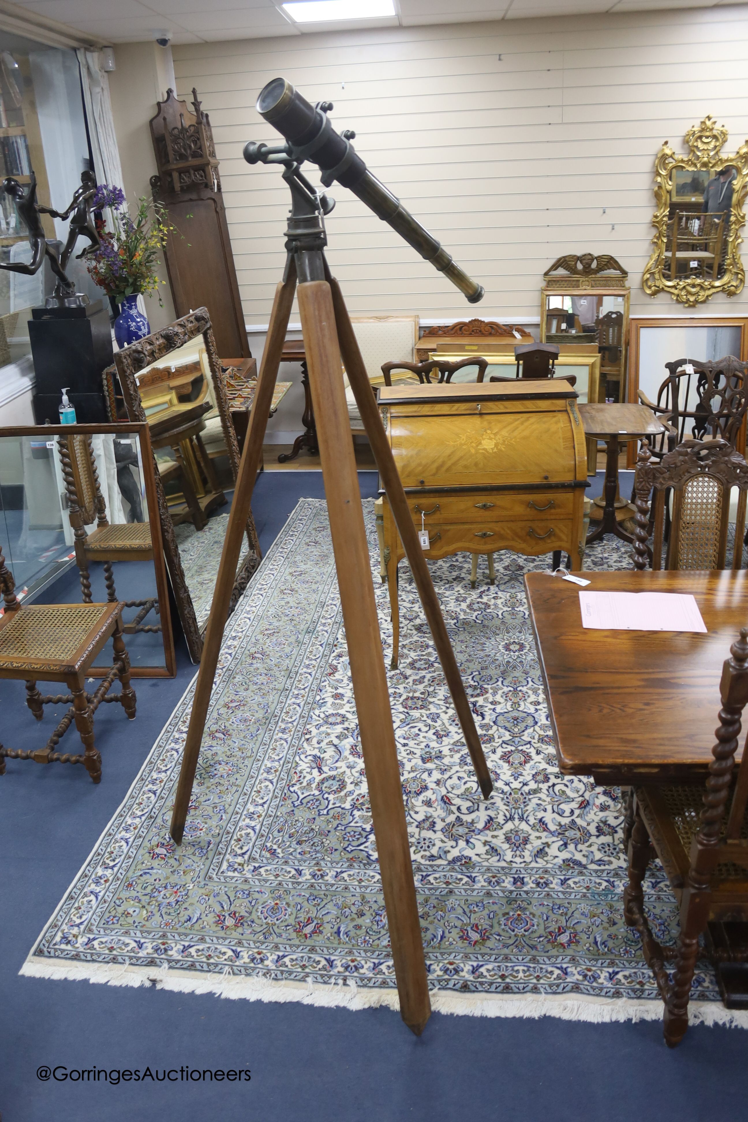 A pair of large plated electric table lamps, each square base marked AWEP, and a plated cake basket